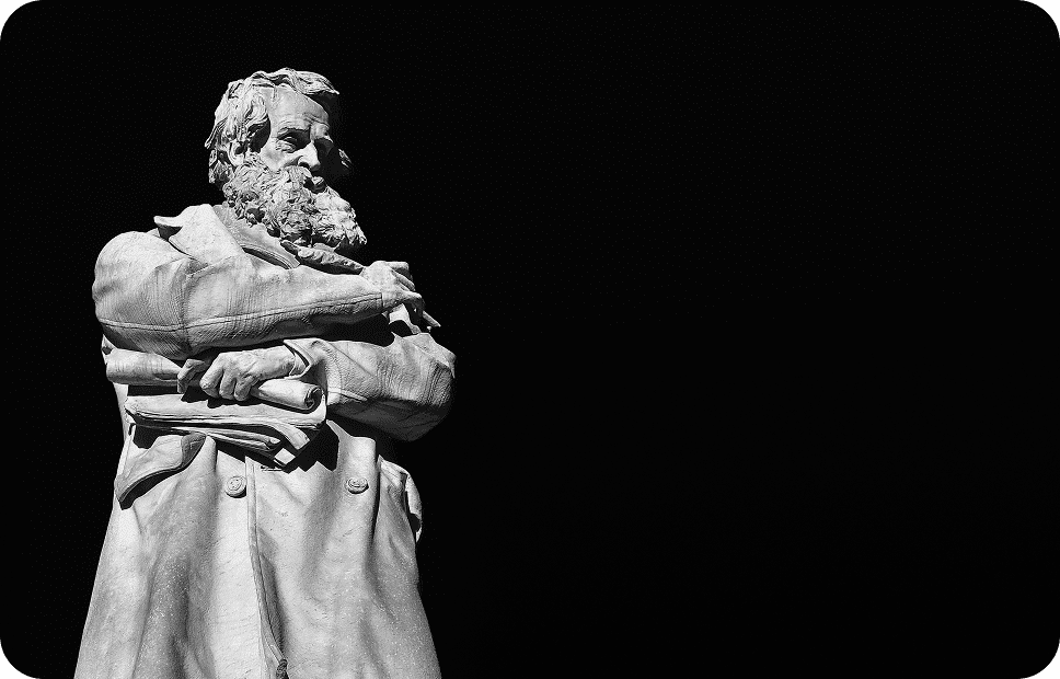 Stone statue of a bearded man.